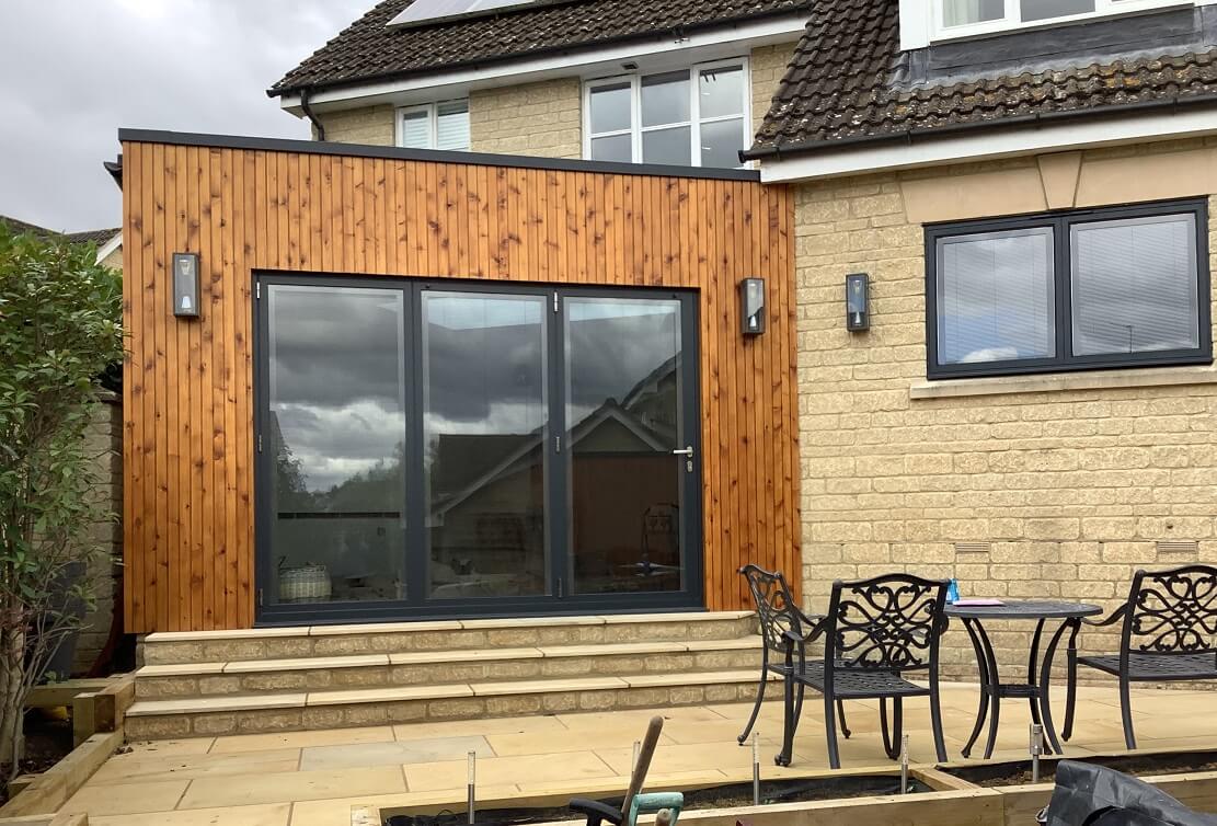 Grey into timber clad bifolds